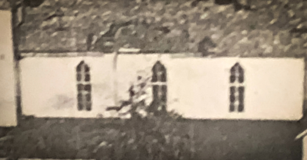 The old church’s tall windows continue to inspire the building’s profile.