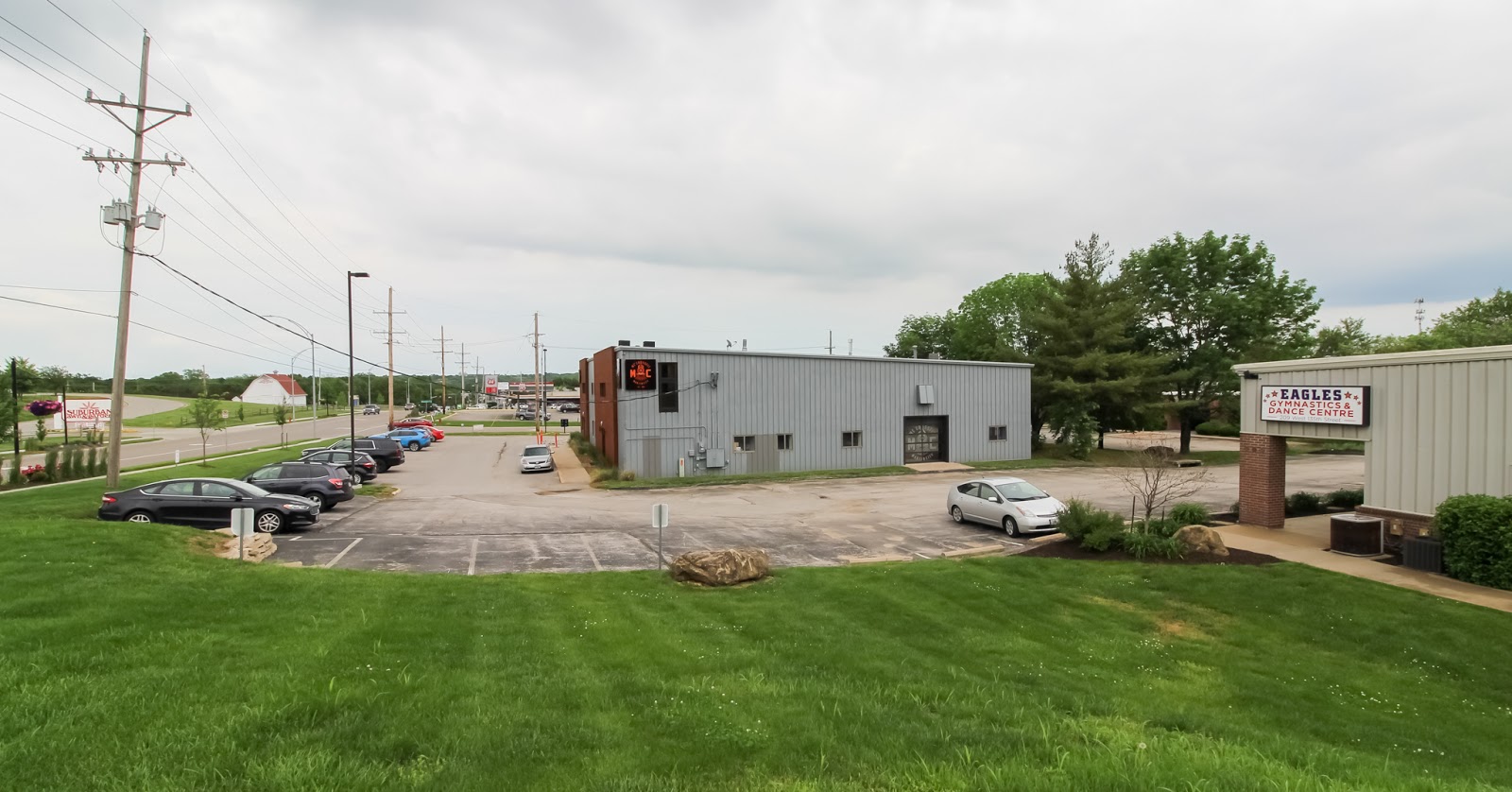 (Left to right, looking east on 135th at Wyandotte) Suburban Lawn & Garden, MC CrossFit, and Eagles Gymnastics & Dance Centre. Schraad & Associates is just beyond the trees.